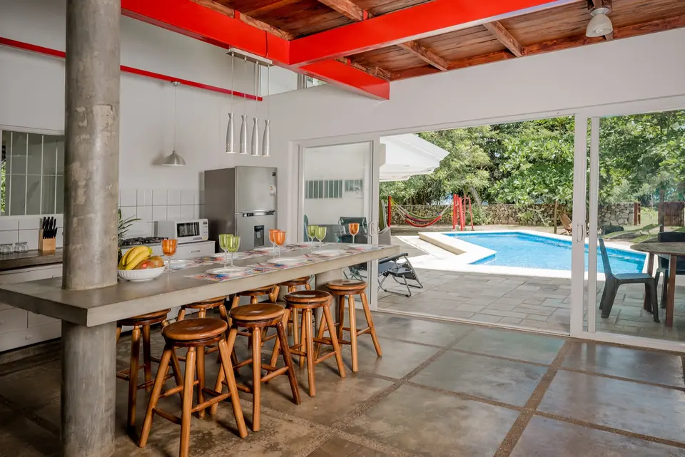 Kitchen opening onto the pool